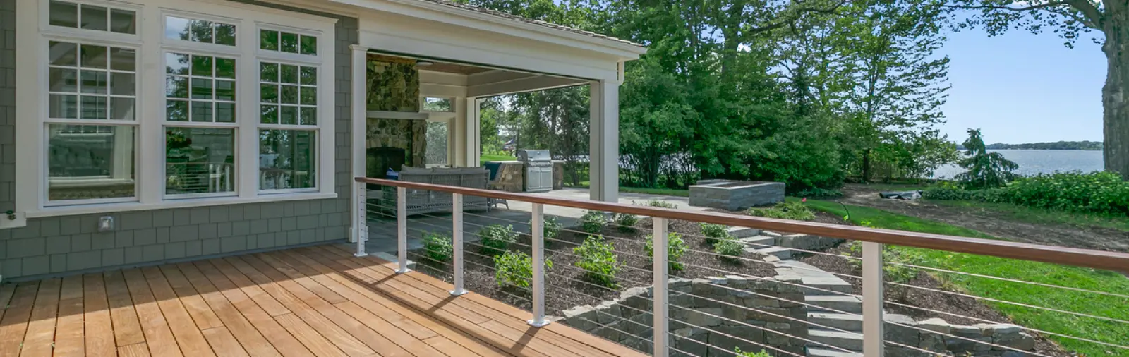 Newly built backyard deck attached to a house.